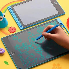 Child drawing on a small electronic tablet with colorful toys around