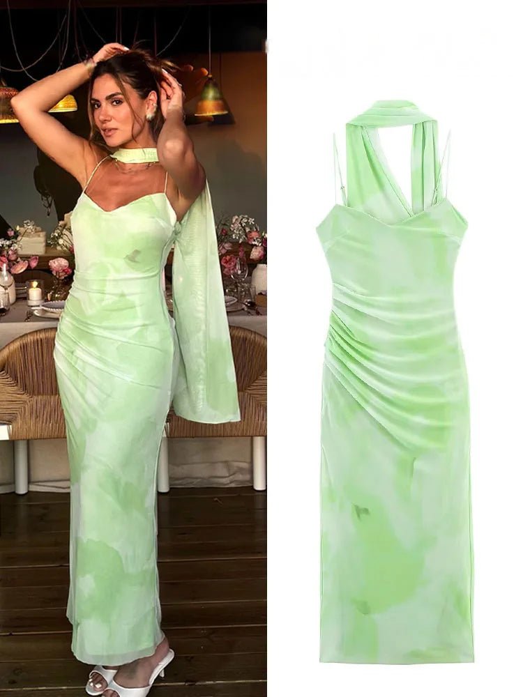 Woman wearing a light green evening gown in an indoor setting