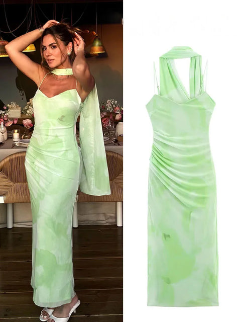 Woman wearing a light green evening gown in an indoor setting