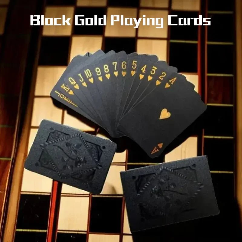 Black gold playing cards fanned out on a wooden surface with 'Black Gold Playing Cards' text.