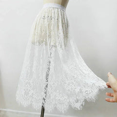 White lace skirt on a mannequin against a plain background