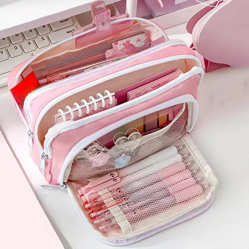 Pink pencil case with stationery items on a white surface