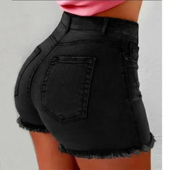 Black denim shorts worn by a person on a gray background