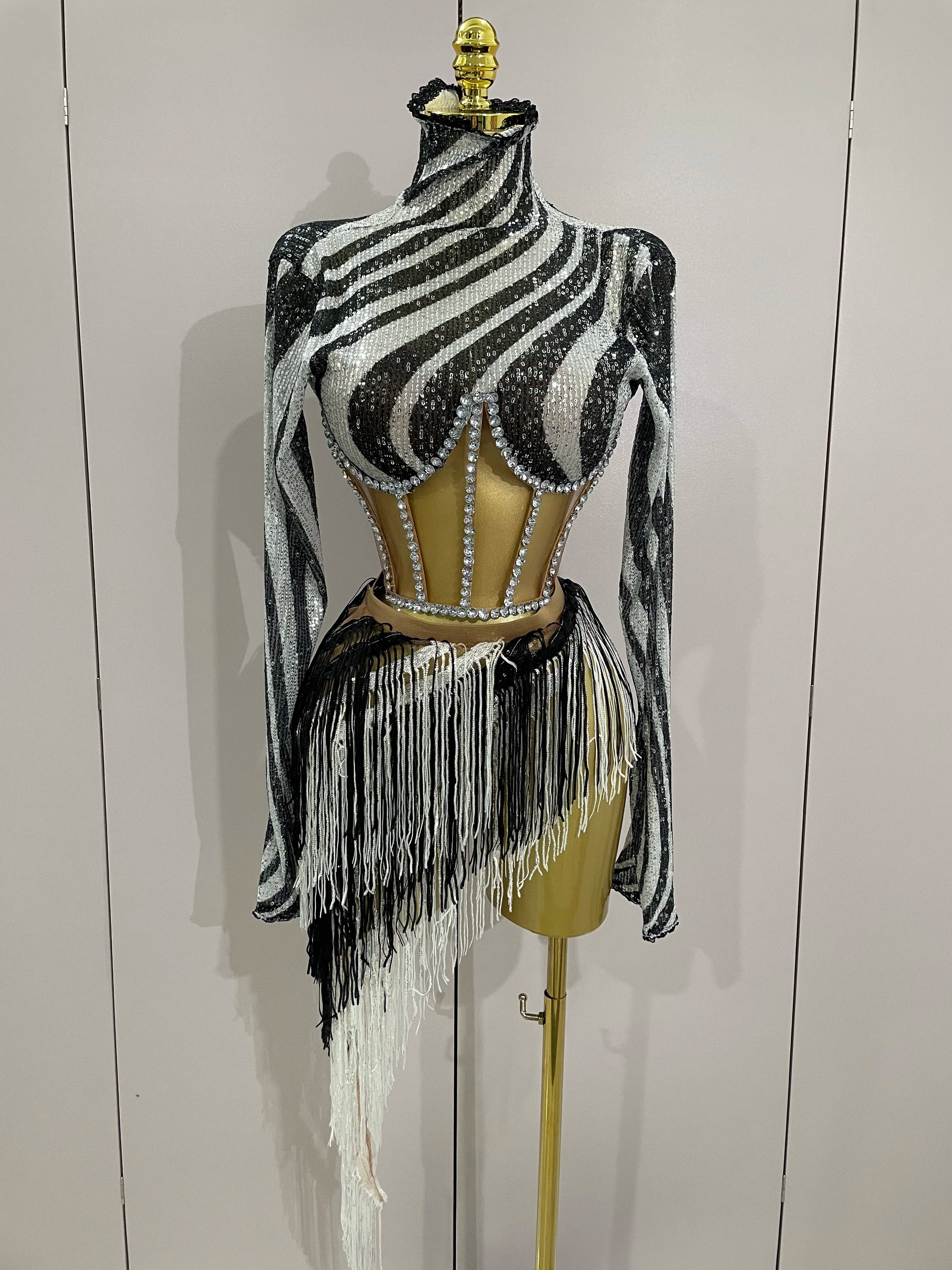 Zebra print top with fringe on a mannequin against a white background