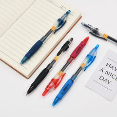 Colorful pens on a notebook with a 'Have a nice day' card.