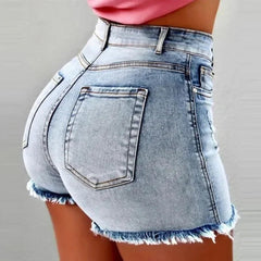 Denim shorts with frayed edges on a plain background