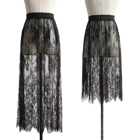Two black lace skirts on mannequins against a white background