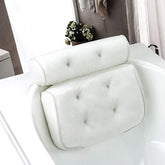 A white 3D mesh bathtub pillow with suction cups on a bathtub, designed for head, neck, back, and shoulder support.