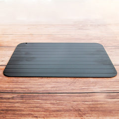 A black, rectangular defrosting tray