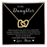A necklace with two heart-shaped pendants, encapsulated in a black case with a quote to a daughter, and a space for a personal message.