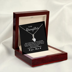 A 14K white gold necklace with a pendant in the shape of a ribbon, presented in a red-toned box with a card that reads 'To My Daughter, When I look at you.