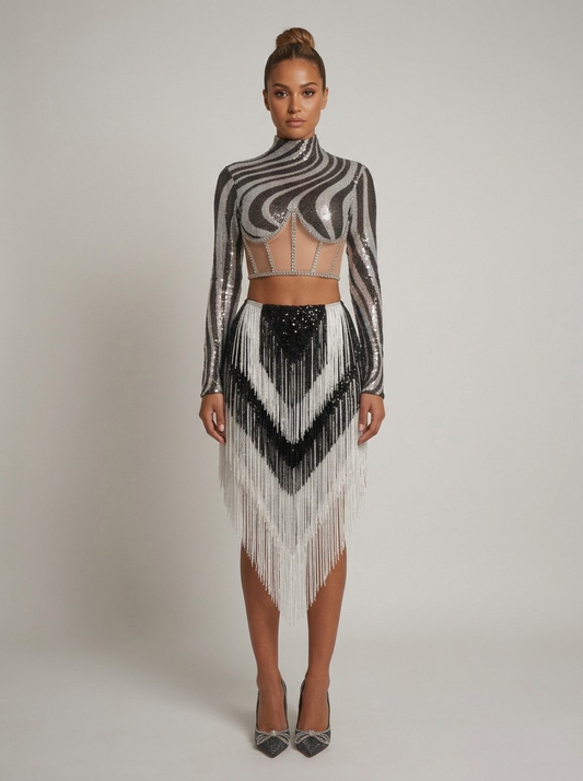 Model wearing a zebra print sequin turtleneck crop top and black and white tassel skirt two-piece set