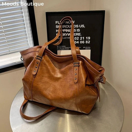Large slouchy PU leather tote bag in brown, from Modernicities' guide to bags for every occasion