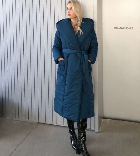 Women's long hooded parka coat in a winter outfit