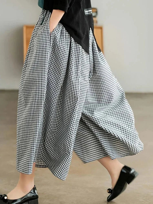 Woman wearing plaid wide leg linen pants, from Modernicities' guide to bottoms for every occasion