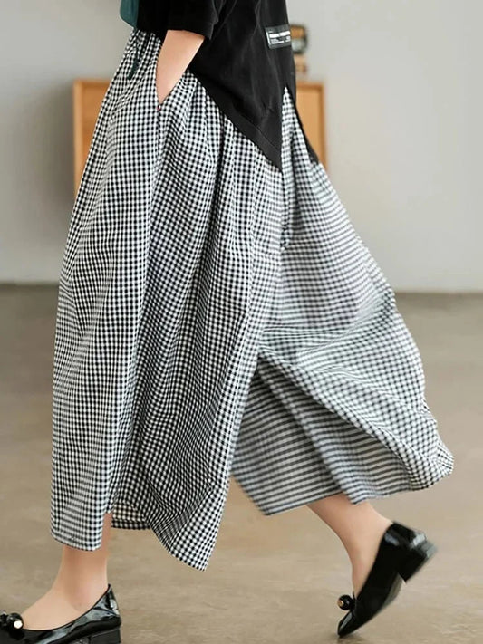 Woman wearing plaid wide leg linen pants, from Modernicities' guide to bottoms for every occasion