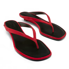 Black and red flip-flops on a white background