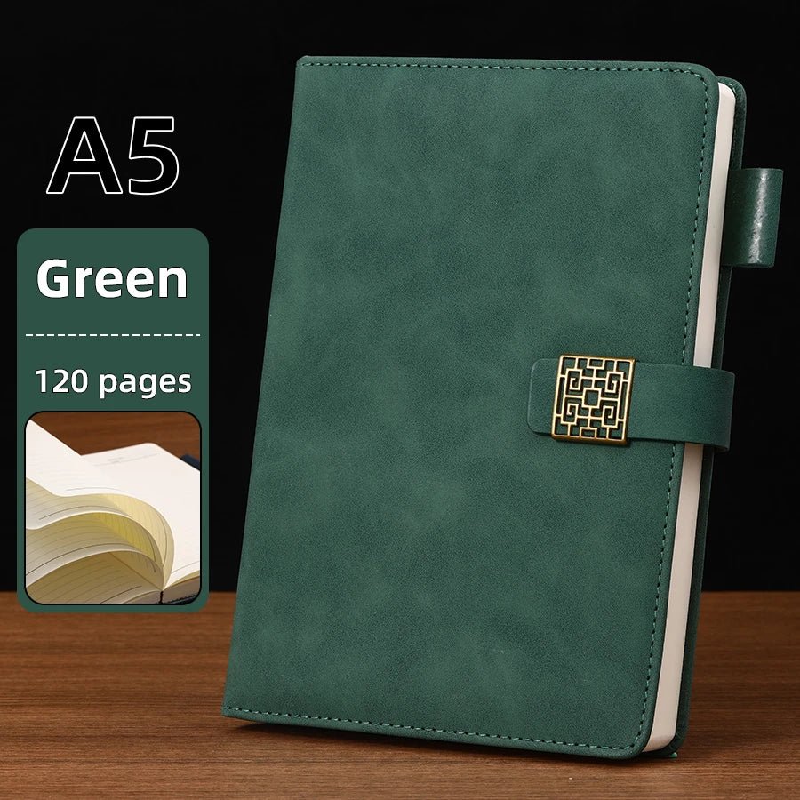 Green notebook with gold buckle on a wooden surface, labeled A5 and 120 pages.