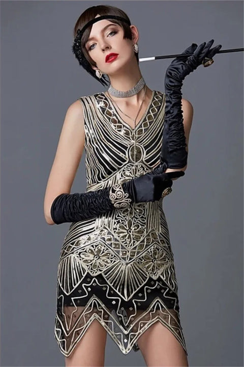 Woman wearing a vintage-style dress with intricate patterns, black gloves, and a headband against a gray background.