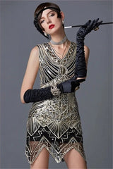Woman wearing a vintage-style dress with intricate patterns, black gloves, and a headband against a gray background.