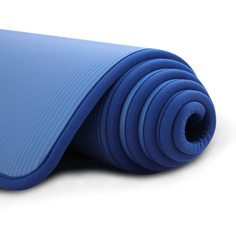Rolled-up blue yoga mat on a white background