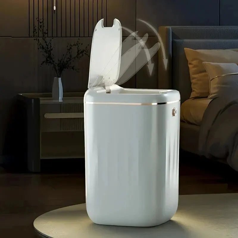 White Smart Sensor Trash Can on a table in a bedroom setting