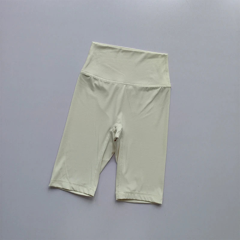 Light green athletic shorts on a gray background
