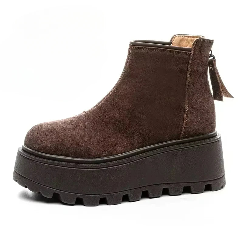 Brown suede platform ankle boot on a white background