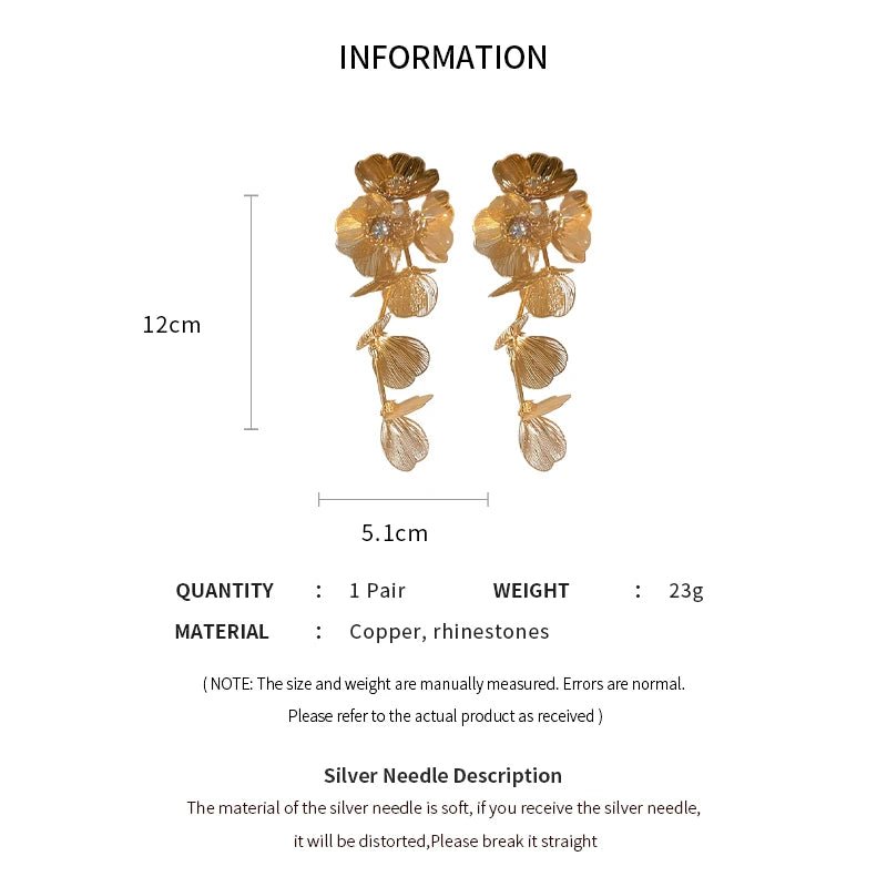 Gold floral earrings with measurements and material details on a white background