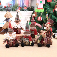 Set of Christmas-themed figurines including snowmen and reindeer on a wooden stand with a festive background.
