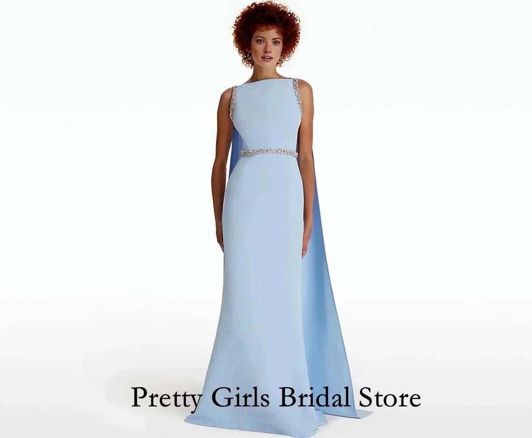 Woman wearing a light blue gown with 'Pretty Girls Bridal Store' text.