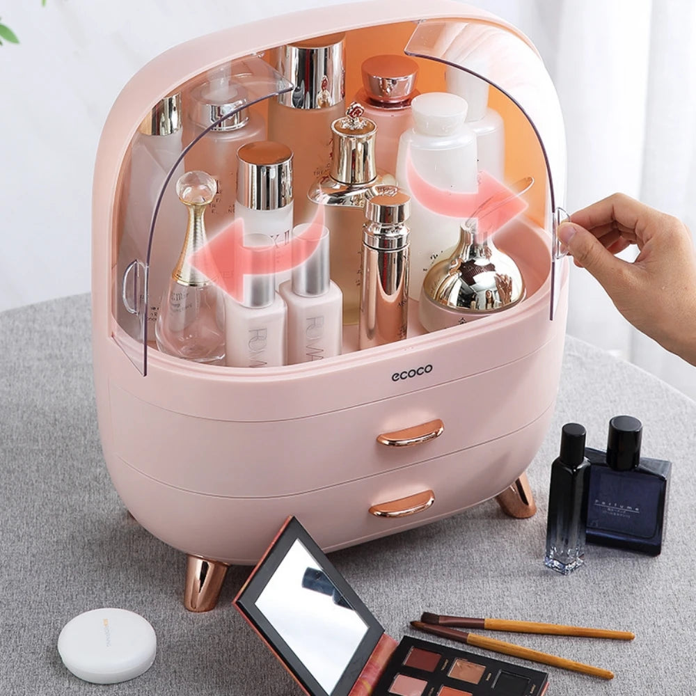 Pink cosmetic organizer with skincare products and makeup items on a light gray surface.