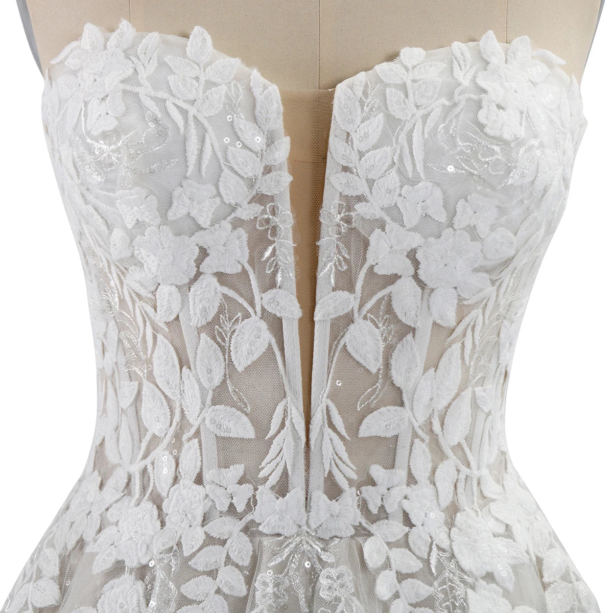 White lace dress on a mannequin with floral patterns