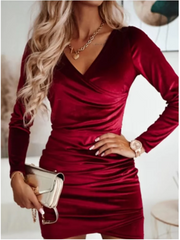 Velvet mini dress with wrap-style V-neck and long sleeves for holiday parties