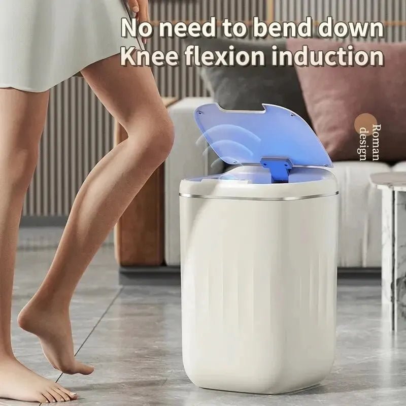 White Smart Sensor Trash Can with blue light on a wooden floor, person using it.