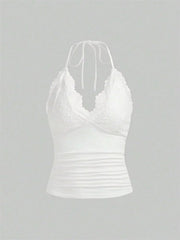 White lace camisole on a gray background