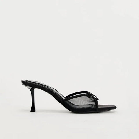 Black high-heeled sandal on a white background
