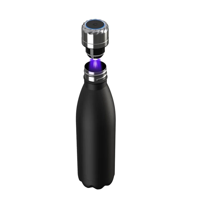 Black water bottle with a metallic cap on a white background