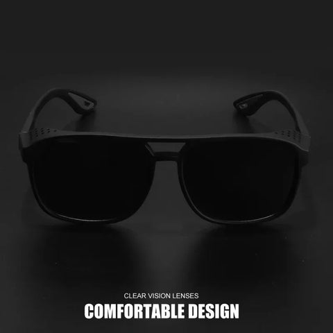 Black sunglasses with clear vision lenses on a dark background