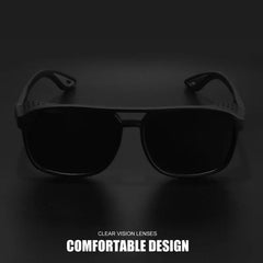 Black sunglasses with clear vision lenses on a dark background