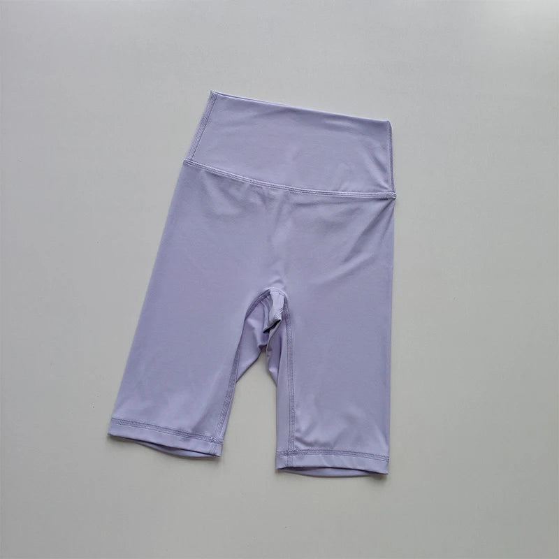Purple athletic shorts on a gray background