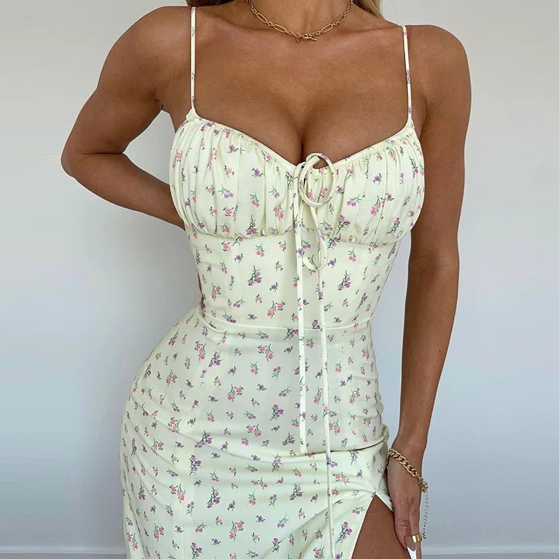Light green floral dress worn by a person against a plain background