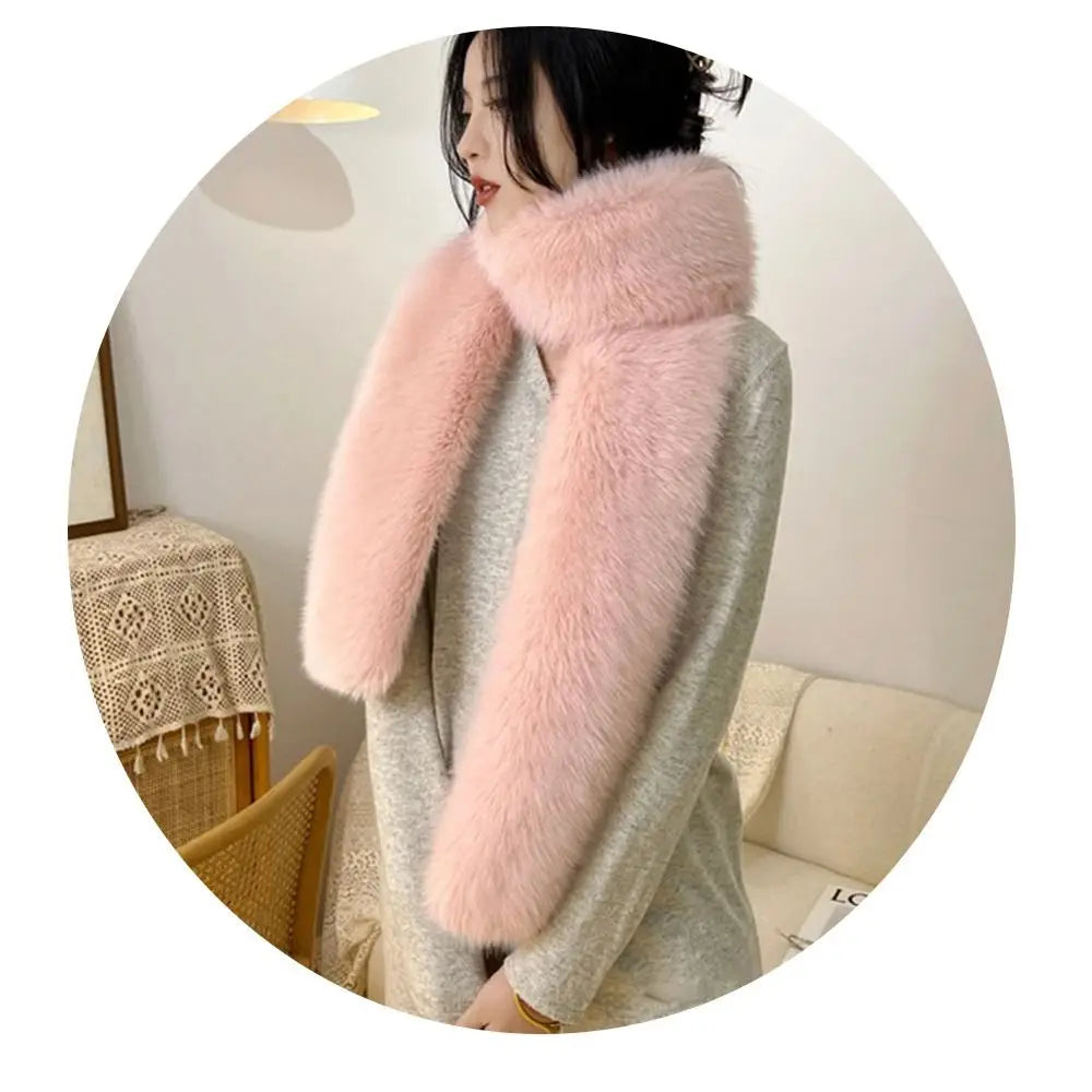 Person wearing a coat with pink fur collar indoors