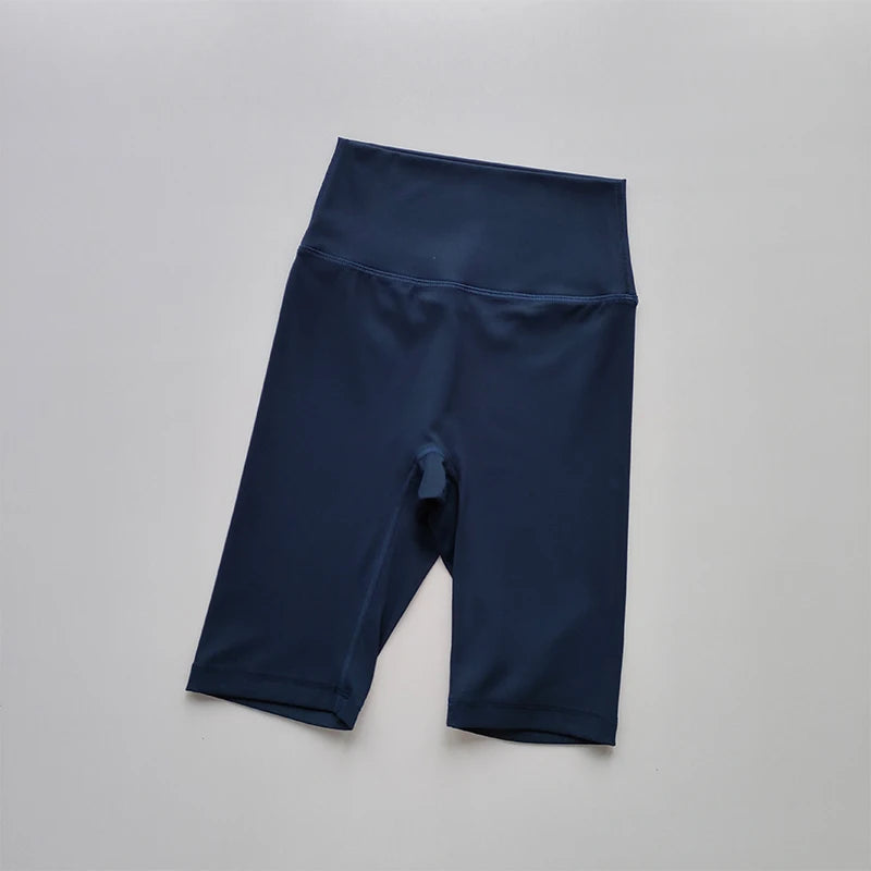 Navy blue athletic shorts on a light gray background