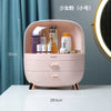 Pink cosmetic organizer with skincare products on a white surface, with measurements indicated.