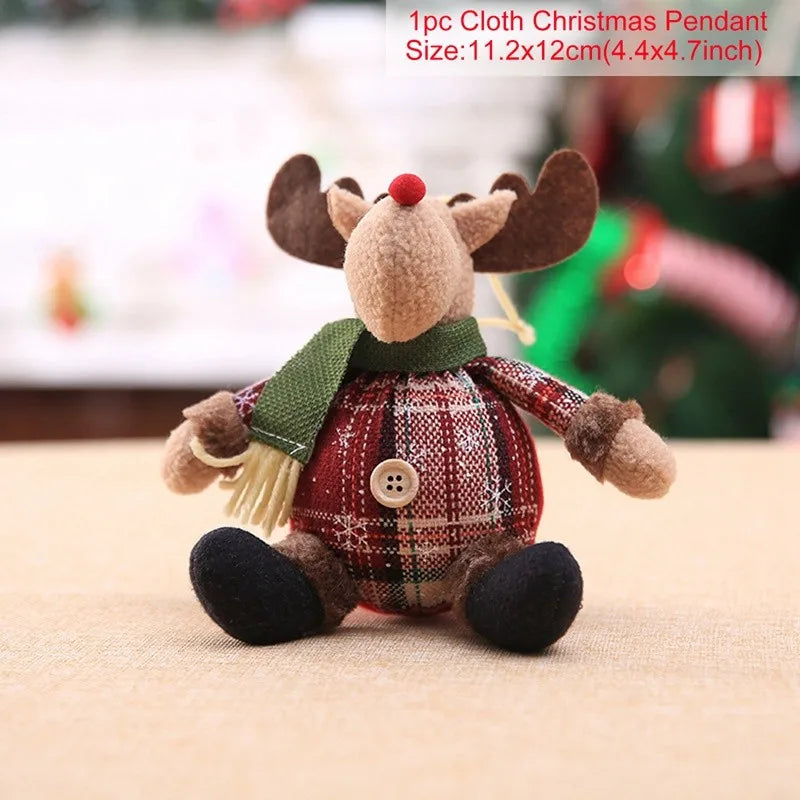 Felt reindeer Christmas pendant with plaid skirt and green scarf on a beige surface.