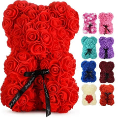 Red rose teddy bear with a black ribbon and additional rose teddy bears in various colors on a white background.