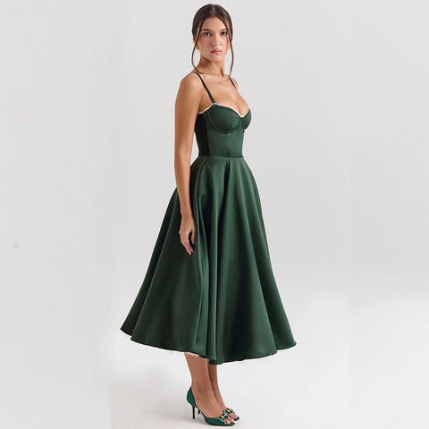 Woman wearing a green dress on a white background