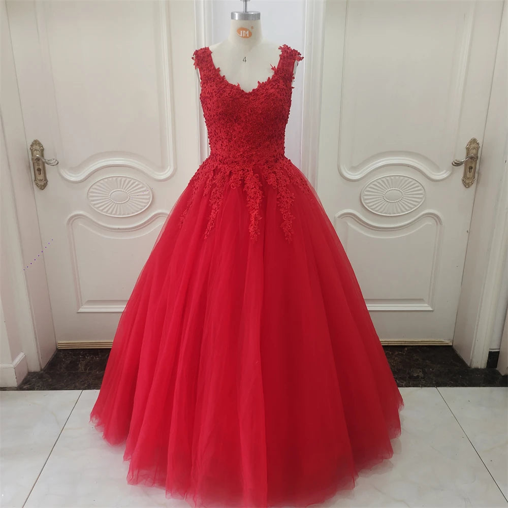 Red lace dress on a mannequin against a white door background