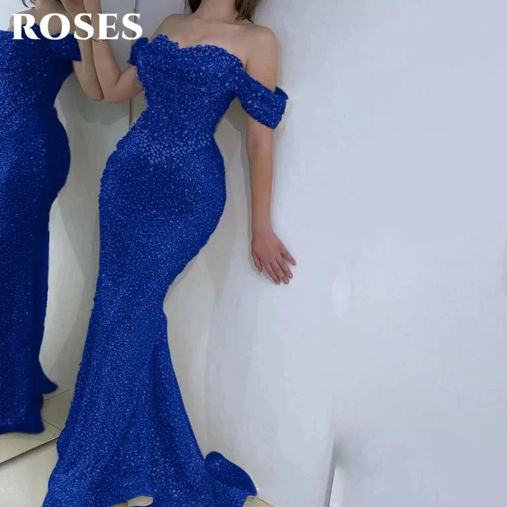 Blue off-shoulder evening gown with a mermaid tail design on a white background.
